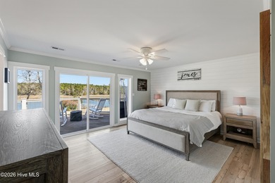 Tucked along a peaceful deep-water canal in the sought-after on Olde Point Golf and Country Club in North Carolina - for sale on GolfHomes.com, golf home, golf lot