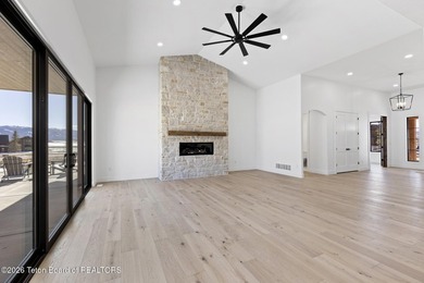 Immerse yourself in the best of Teton Valley living with this on Teton Reserve in Idaho - for sale on GolfHomes.com, golf home, golf lot