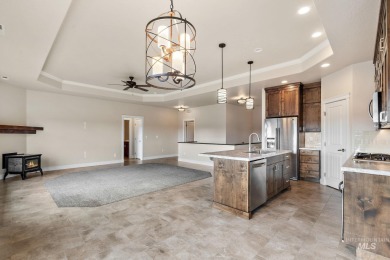 Spacious and thoughtfully designed, this 4-bedroom, 3.5-bath on Hunters Point Golf Club in Idaho - for sale on GolfHomes.com, golf home, golf lot