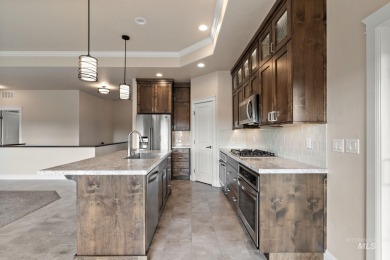 Spacious and thoughtfully designed, this 4-bedroom, 3.5-bath on Hunters Point Golf Club in Idaho - for sale on GolfHomes.com, golf home, golf lot