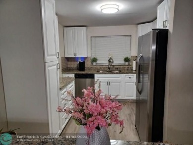 Charming 2 Bedroom /2 Bath Lake View Condominium. Modern kitchen on Sunrise Lakes Phase III in Florida - for sale on GolfHomes.com, golf home, golf lot