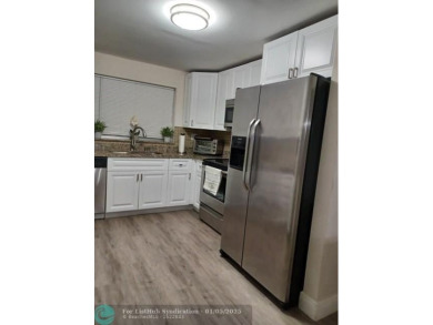 Charming 2 Bedroom /2 Bath Lake View Condominium. Modern kitchen on Sunrise Lakes Phase III in Florida - for sale on GolfHomes.com, golf home, golf lot
