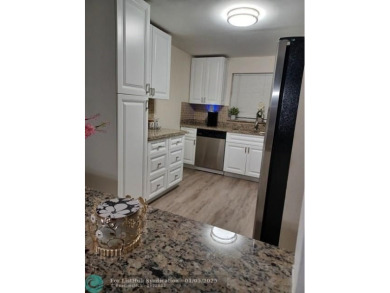 Charming 2 Bedroom /2 Bath Lake View Condominium. Modern kitchen on Sunrise Lakes Phase III in Florida - for sale on GolfHomes.com, golf home, golf lot