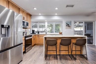 Live your best South Florida life in this charming 3/2 pool home on Cooper Colony Country Club in Florida - for sale on GolfHomes.com, golf home, golf lot