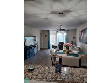Charming 2 Bedroom /2 Bath Lake View Condominium. Modern kitchen on Sunrise Lakes Phase III in Florida - for sale on GolfHomes.com, golf home, golf lot