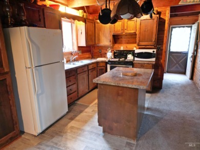 Among the serene wooded pines, this cozy, rustic cabin is a on Terrace Lakes Golf Resort in Idaho - for sale on GolfHomes.com, golf home, golf lot
