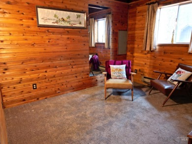 Among the serene wooded pines, this cozy, rustic cabin is a on Terrace Lakes Golf Resort in Idaho - for sale on GolfHomes.com, golf home, golf lot