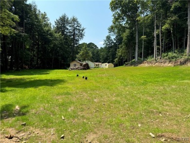 This adorable ranch style home neighbors up to the 18th hole of on Cedar Lake Club in New York - for sale on GolfHomes.com, golf home, golf lot