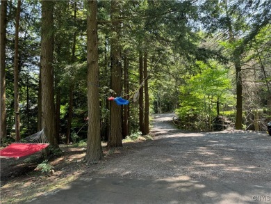 This adorable ranch style home neighbors up to the 18th hole of on Cedar Lake Club in New York - for sale on GolfHomes.com, golf home, golf lot