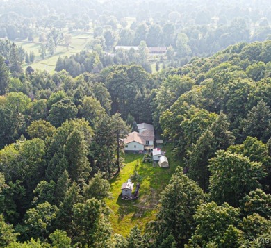 This adorable ranch style home neighbors up to the 18th hole of on Cedar Lake Club in New York - for sale on GolfHomes.com, golf home, golf lot