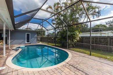 Live your best South Florida life in this charming 3/2 pool home on Cooper Colony Country Club in Florida - for sale on GolfHomes.com, golf home, golf lot