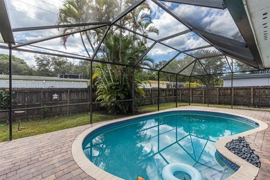 Live your best South Florida life in this charming 3/2 pool home on Cooper Colony Country Club in Florida - for sale on GolfHomes.com, golf home, golf lot
