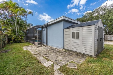 Live your best South Florida life in this charming 3/2 pool home on Cooper Colony Country Club in Florida - for sale on GolfHomes.com, golf home, golf lot