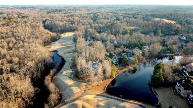 Nestled on a secluded peninsula in the prestigious Ford's Colony on Fords Colony Country Club in Virginia - for sale on GolfHomes.com, golf home, golf lot
