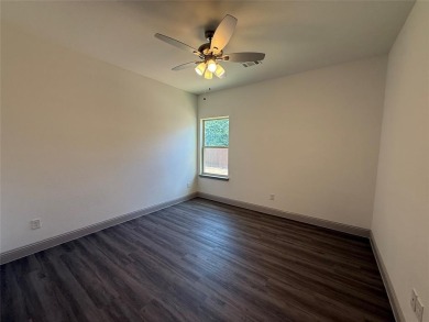 This 4-bedroom, 3-bath home sits on over half an acre on a quiet on Lake Kiowa Golf Course in Texas - for sale on GolfHomes.com, golf home, golf lot