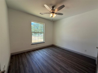 This 4-bedroom, 3-bath home sits on over half an acre on a quiet on Lake Kiowa Golf Course in Texas - for sale on GolfHomes.com, golf home, golf lot