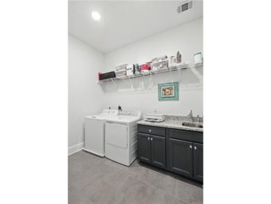 This spacious single-level twin home offers a thoughtfully on The Auburn University Club in Alabama - for sale on GolfHomes.com, golf home, golf lot