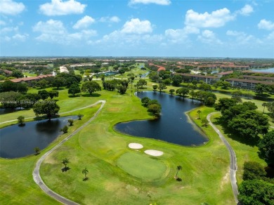 Welcome to your personal paradise in Century Village, a gated on Flamingo Lakes Country Club in Florida - for sale on GolfHomes.com, golf home, golf lot