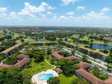 Welcome to your personal paradise in Century Village, a gated on Flamingo Lakes Country Club in Florida - for sale on GolfHomes.com, golf home, golf lot