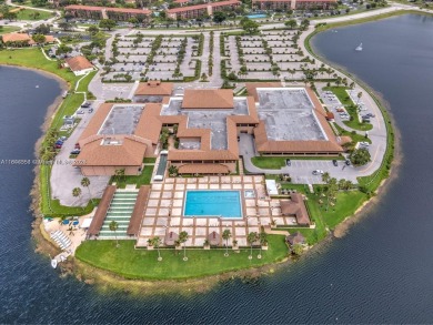 Welcome to your personal paradise in Century Village, a gated on Flamingo Lakes Country Club in Florida - for sale on GolfHomes.com, golf home, golf lot