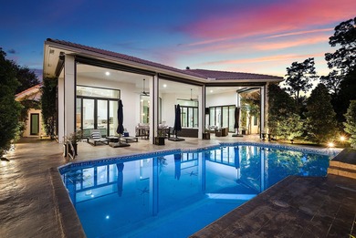 Nestled on 1.35 acres in the prestigious Sherbrooke Estates on Sherbrooke Golf and Country Club in Florida - for sale on GolfHomes.com, golf home, golf lot