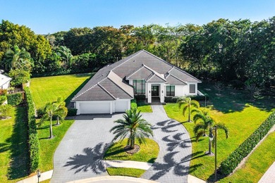 Welcome to an extraordinary, fully reimagined contemporary on Bocaire Country Club in Florida - for sale on GolfHomes.com, golf home, golf lot