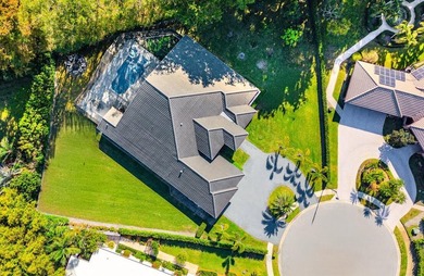 Welcome to an extraordinary, fully reimagined contemporary on Bocaire Country Club in Florida - for sale on GolfHomes.com, golf home, golf lot