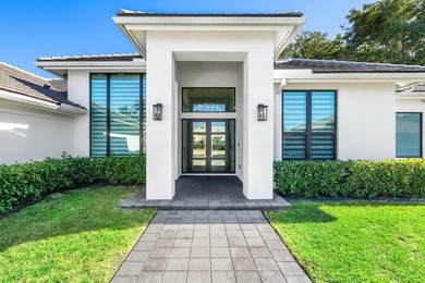 Welcome to an extraordinary, fully reimagined contemporary on Bocaire Country Club in Florida - for sale on GolfHomes.com, golf home, golf lot