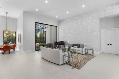 Welcome to an extraordinary, fully reimagined contemporary on Bocaire Country Club in Florida - for sale on GolfHomes.com, golf home, golf lot