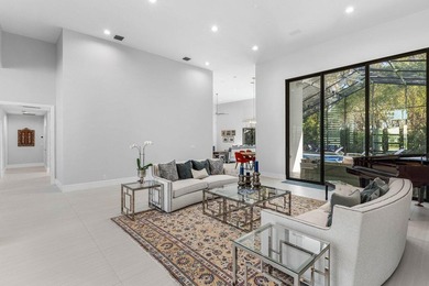 Welcome to an extraordinary, fully reimagined contemporary on Bocaire Country Club in Florida - for sale on GolfHomes.com, golf home, golf lot