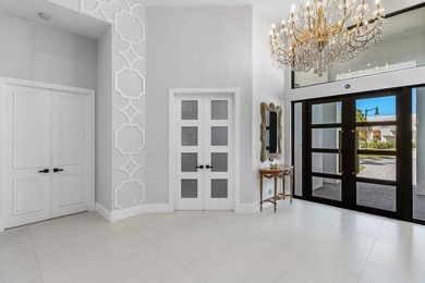 Welcome to an extraordinary, fully reimagined contemporary on Bocaire Country Club in Florida - for sale on GolfHomes.com, golf home, golf lot