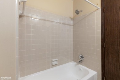 This beautifully maintained two-story condo features two on Plum Brook Golf Club in Michigan - for sale on GolfHomes.com, golf home, golf lot