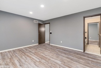 This beautifully maintained two-story condo features two on Plum Brook Golf Club in Michigan - for sale on GolfHomes.com, golf home, golf lot