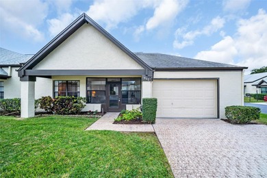 Welcome to this beautiful end-unit Sutton Place villa, offering on Highland Lakes Executive Golf Course in Florida - for sale on GolfHomes.com, golf home, golf lot