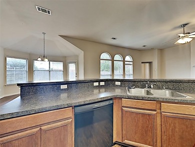 Discover the perfect blend of comfort and convenience in this on Mansfield National Golf Club in Texas - for sale on GolfHomes.com, golf home, golf lot