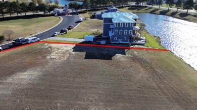 Generous lot directly overlooking the fountain at Crystal Lake on Bay Creek Golf Club in Virginia - for sale on GolfHomes.com, golf home, golf lot