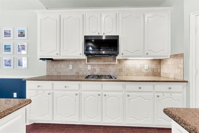 Tucked inside a gated, resort-style community, this home offers on The Golf Club at Resort Eagle Mountain Lake in Texas - for sale on GolfHomes.com, golf home, golf lot