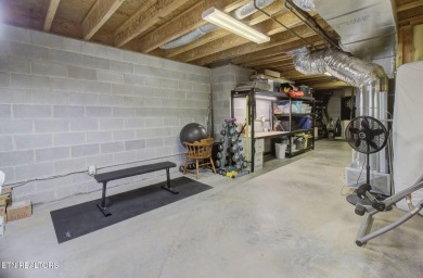 Nestled in the sought-after Tanasi Coves neighborhood of Tellico on Tanasi Golf Course in Tennessee - for sale on GolfHomes.com, golf home, golf lot