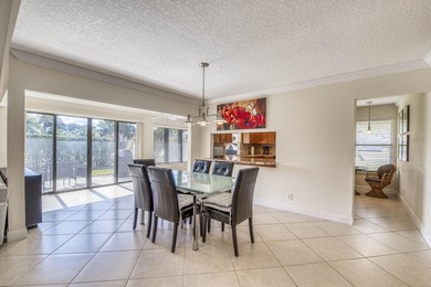 Welcome home to this delightful, bright and updated home in on Old Marsh Golf Club in Florida - for sale on GolfHomes.com, golf home, golf lot