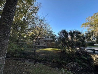 Charming 3-bedroom retreat with creekside views in Turkey Creek on Turkey Creek Golf and Country Club in Florida - for sale on GolfHomes.com, golf home, golf lot