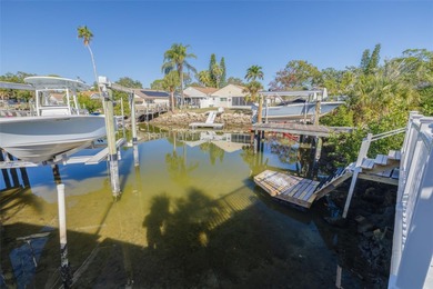 Welcome to this inviting waterfront community, where a tropical on Gulf Harbors Golf Course in Florida - for sale on GolfHomes.com, golf home, golf lot