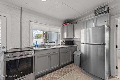 This 2nd row home on Oak Island that is known to the locals as on Founders Club At St. James Plantation in North Carolina - for sale on GolfHomes.com, golf home, golf lot