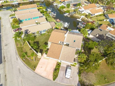 Welcome to this inviting waterfront community, where a tropical on Gulf Harbors Golf Course in Florida - for sale on GolfHomes.com, golf home, golf lot
