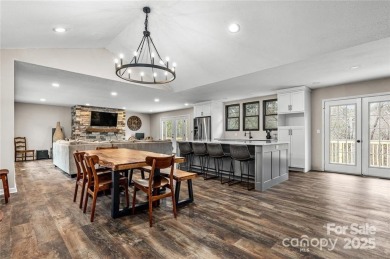This beautifully updated turn-key furnished home is located on Rumbling Bald Resort on Lake Lure in North Carolina - for sale on GolfHomes.com, golf home, golf lot