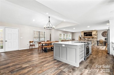 This beautifully updated turn-key furnished home is located on Rumbling Bald Resort on Lake Lure in North Carolina - for sale on GolfHomes.com, golf home, golf lot
