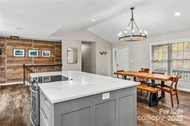 This beautifully updated turn-key furnished home is located on Rumbling Bald Resort on Lake Lure in North Carolina - for sale on GolfHomes.com, golf home, golf lot