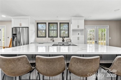 This beautifully updated turn-key furnished home is located on Rumbling Bald Resort on Lake Lure in North Carolina - for sale on GolfHomes.com, golf home, golf lot