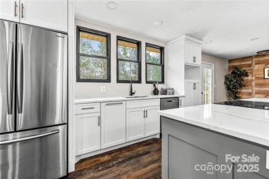 This beautifully updated turn-key furnished home is located on Rumbling Bald Resort on Lake Lure in North Carolina - for sale on GolfHomes.com, golf home, golf lot