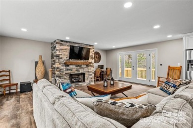 This beautifully updated turn-key furnished home is located on Rumbling Bald Resort on Lake Lure in North Carolina - for sale on GolfHomes.com, golf home, golf lot