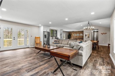 This beautifully updated turn-key furnished home is located on Rumbling Bald Resort on Lake Lure in North Carolina - for sale on GolfHomes.com, golf home, golf lot